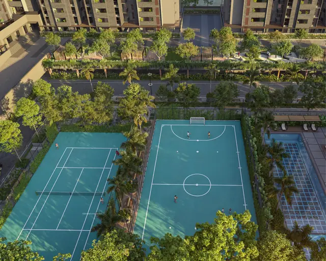 Aerial view of tennis and futsal courts next to the pool at Assetz Niwa & Neo